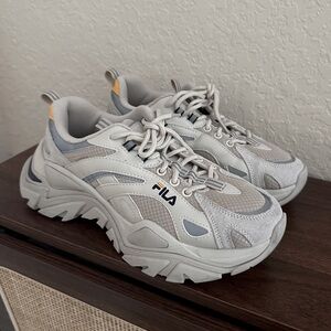 FILA x BTS grey, tan, and white trainers. K-pop sneakers.
